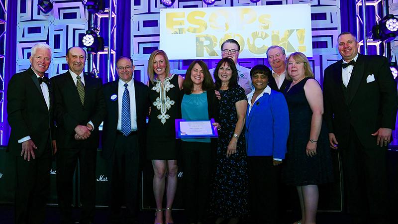 Miklos Systems Inc. on stage after winning 2019 ESOP Company of the Year Award 